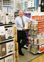 George Davison with Davison Produced Product Invention Cap Racks in the store it's selling in