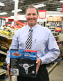 George Davison with Davison Produced Product Invention Steering Reel Cord Storage in the store it's selling in.