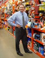 Mr. Davison, Founder and CEO, shown with product on the store shelf