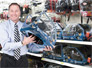 George Davison with product invention Fuel Helmet in the store