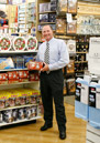 George Davison with product invention Pugz Shoes at the store