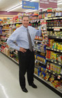 George Davison with Davison Produced Product Invention Kitchen Cap in the store it's selling in.