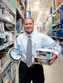 George Davison with Davison Produced Product Invention Spin 'n Store Parts Carousel in the store it's selling in