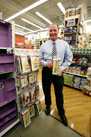 Mr. Davison with Davison Product Invention Purse Rack on the store shelf
