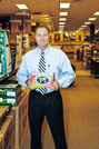 George Davison with product invention RV Leveler in the store