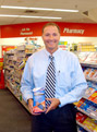 Mr. Davison with 360 Therapy Wrist Brace on store shelf