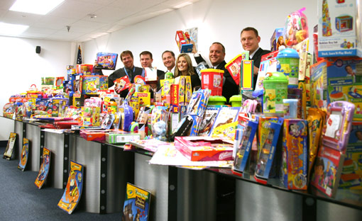 George Davison and Davison Employees with toys purchased