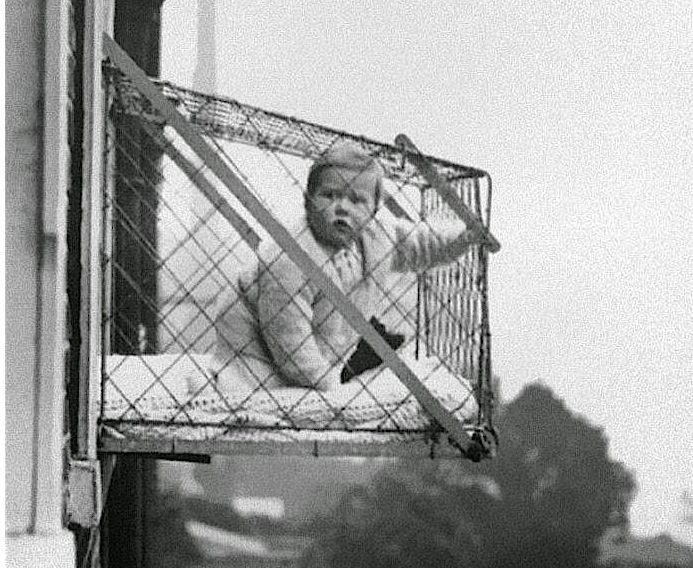 Baby in a Window Cage
